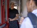 Nurse visiting woman at her house