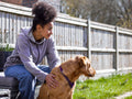 Girl with dog in backyard