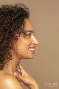 Profile of smiling woman with curly hair