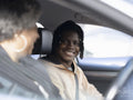 Mother and son sitting in car