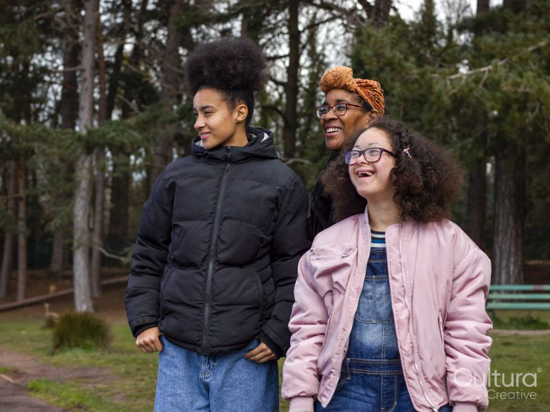 Mother with two daughters in park