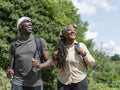 Smiling mature couple hiking in summer