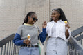 Young female couple eating ice cream