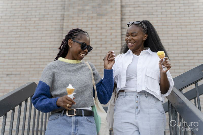 Young female couple eating ice cream