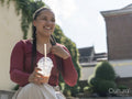 Portrait of smiling woman with smoothie