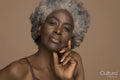 Studio portrait of pensive senior woman