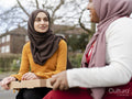 Friends having lunch in park