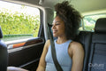 Young woman sitting in car