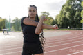 Female athlete stretching arms before training