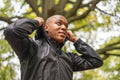 Man wearing rain jacket in forest