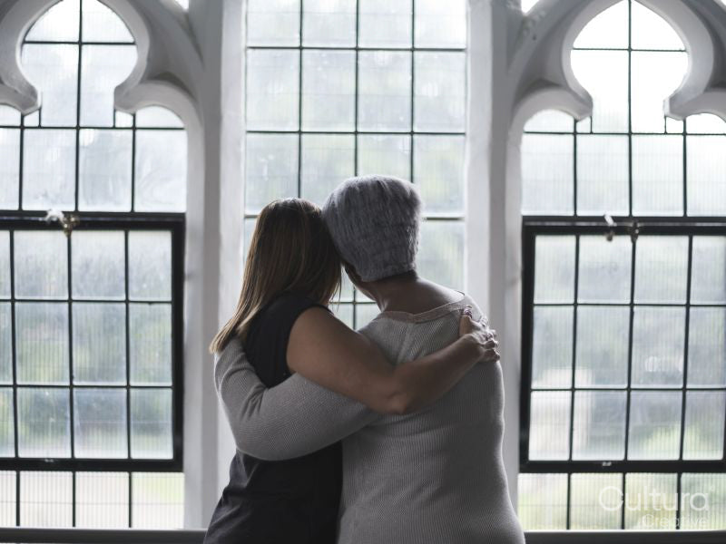 Women hugging in therapy session