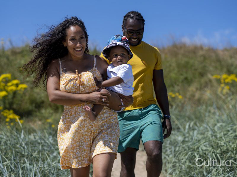 Family with baby son going to beach