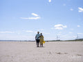 Mature couple walking on beach