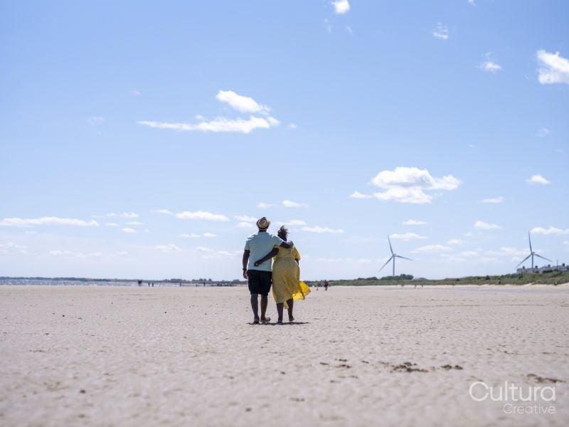 Mature couple walking on beach