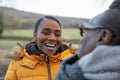 Two women laughing in rural setting