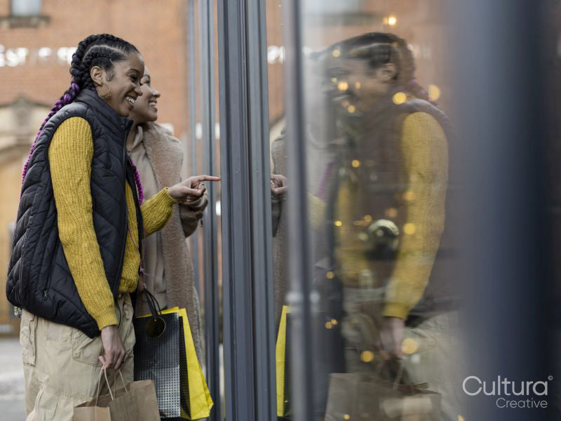 Two young women window shopping