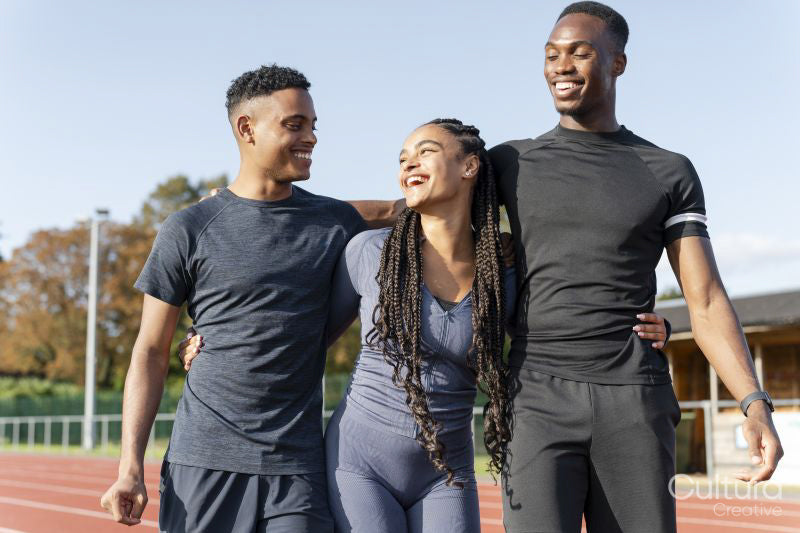 Portrait of group of athletes standing at stadium