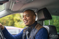 Smiling man driving car