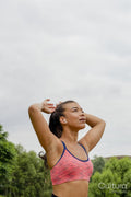 Portrait of woman tying hair before training
