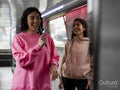 Cheerful women singing on boat