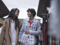 Female couple shopping in street market