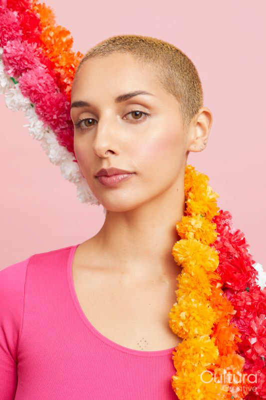 Portrait of blond woman with floral garlands