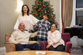 Multi generation family with boy during Christmas time in nursing home