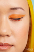 Young woman with orange make up