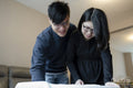 Parents looking into baby crib