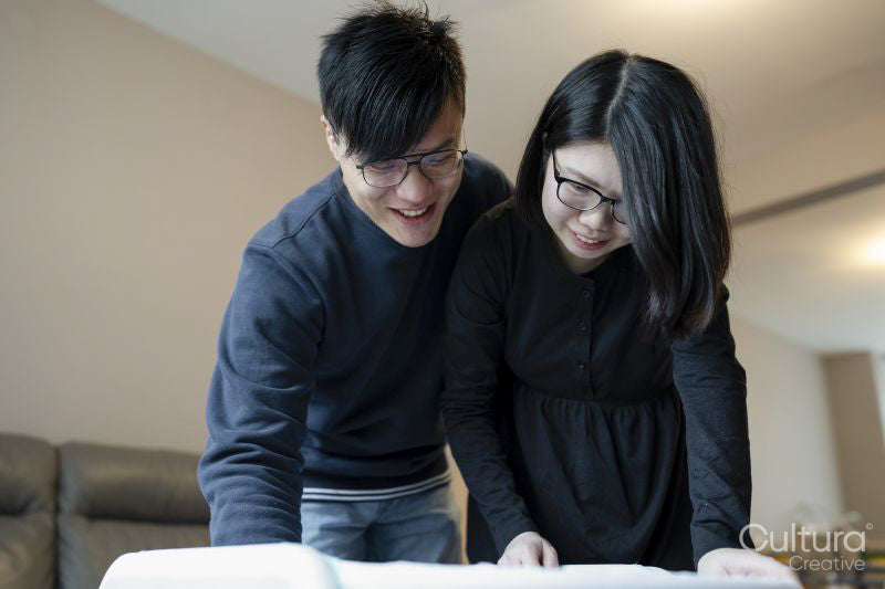 Parents looking into baby crib
