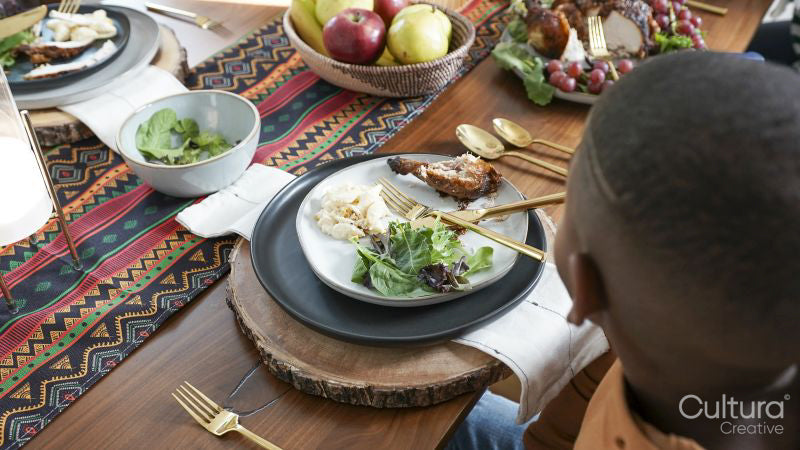 Boy eating Kwanzaa meal
