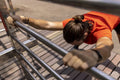 Brazil, Sao Paulo, Man in sports clothing exercising in park