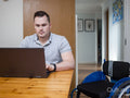 Man using laptop at home