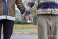 Mid adult men holding hands, close up