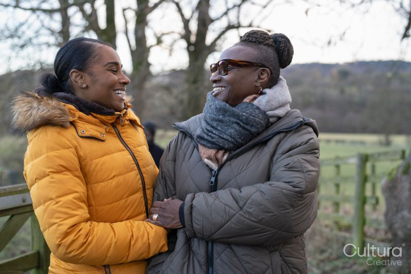 Two women posing in rural setting
