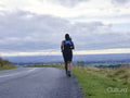 Female runner on country road
