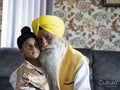 Portrait of grandfather and grandson in traditional clothing
