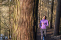 Young woman jogging in forest