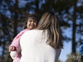 Mother hugging daughter with Down syndrome