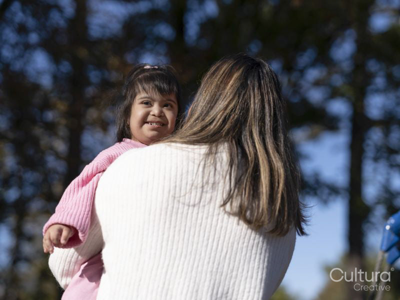Mother hugging daughter with Down syndrome