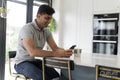 Man using phone while sitting at table