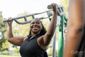 Young women exercising in outdoor gym