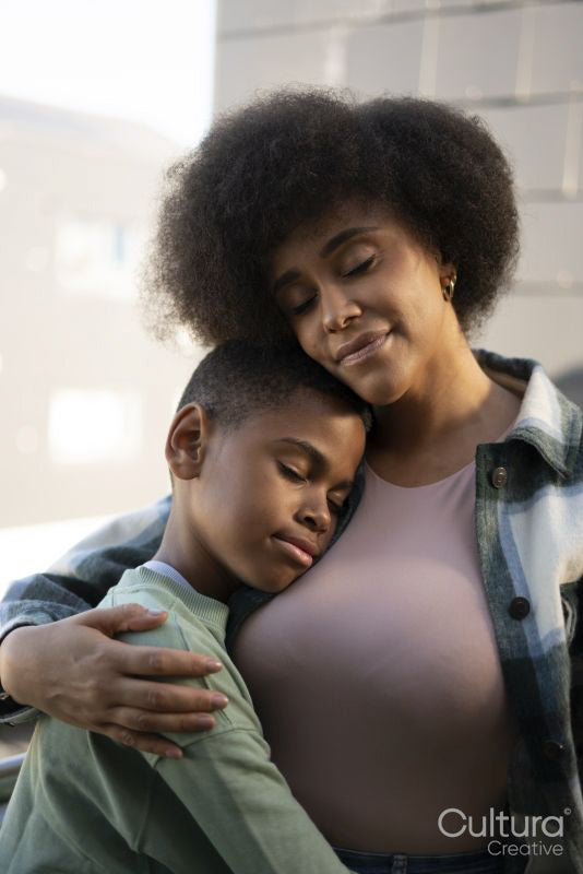 Smiling mother and son hugging