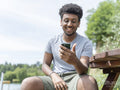 Smiling man during video call on sunny day