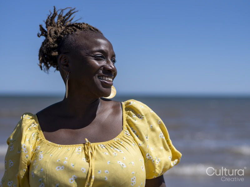 Smiling mature woman on beach