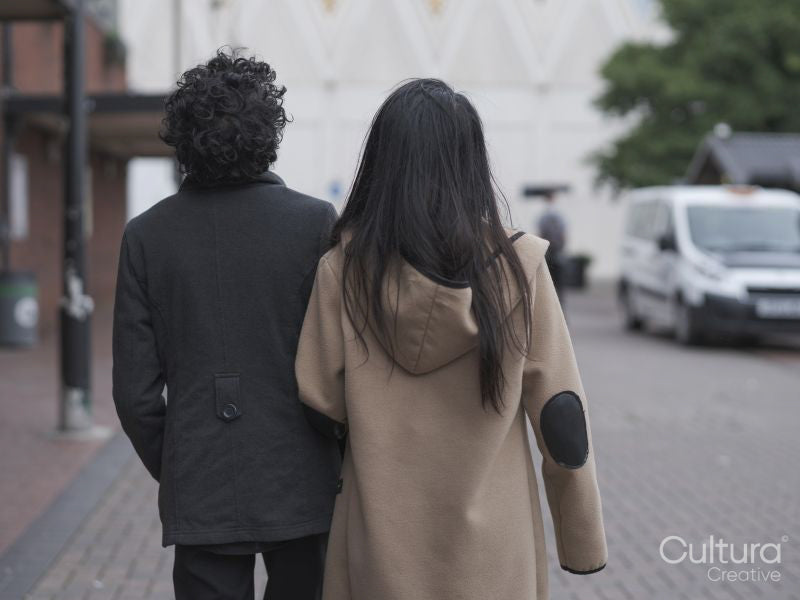 Female couple walking in street