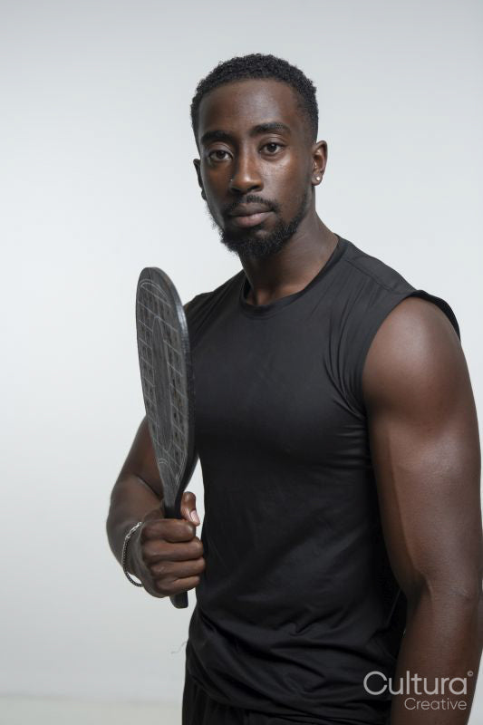 Portrait of man holding pickleball racket