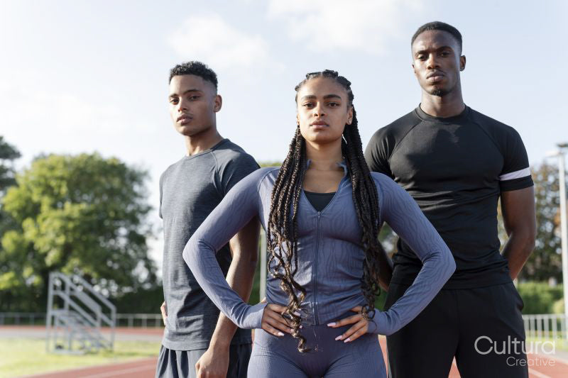 Portrait of group of athletes standing at stadium