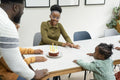 Family with children celebrating birthday at home