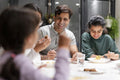 Family dining at home in evening